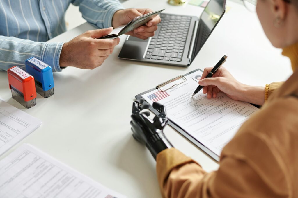 Woman filing documents for visa